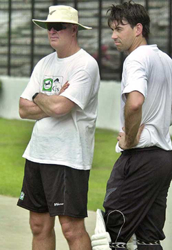 New Zealand cricket coach John Bracewell and captain Stephen Fleming look on during a practice session