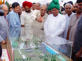 Mr S.K Monga, Managing Director, Haryana Power Generation Corporation, explains the model of the Thermal Power Project to Haryana Chief Minister Om Prakash Chautala in Yamunanagar on Thursday