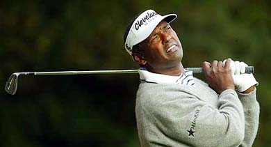 Fiji's Vijay Singh watches his tee shot