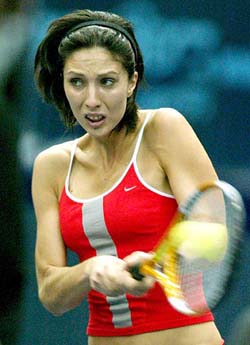 Anastasia Myskina of Russia returns the ball to compatriot Elena Likhovtseva