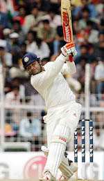Virender Sehwag hits a shot during the second day’s play of the second Test match between India and Australia in Chennai on Friday.