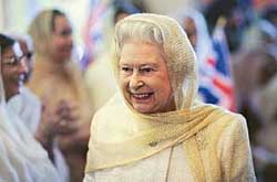 Britain’s Queen Elizabeth smiles during a visit to Gurdwara Sri Guru Singh Sabha in Hounslow, west London on Friday.