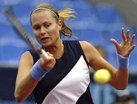 Elena Bovina of Russia returns a shot during a match against Venus Williams