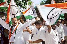 Nationalist Congress Party workers, an ally of the ruling Congress, dance in celebration in Mumbai on Saturday. The NCP emerged as the single largest party in the Maharashtra Assembly elections.