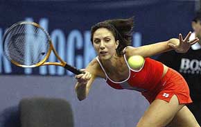 Anastasia Myskina of Russia returns a shot during her semifinal match against Lindsay Davenport of the USA