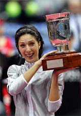 Russia�s Anastasia Myskina lifts the trophy after beating compatriot Elena Dementieva in the Kremlin Cup final in Moscow