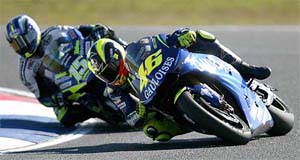 MotoGP riders Valentino Rossi of Italy, on Yamaha, leads Sete Gibernau of Spain