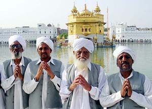 Ashiq Ali Bhai Lal (left), 17th generation descendant of Bhai Mardana (the companion of Guru Nanak Dev on his journey across the sub-continent and abroad) along with his brother Bhai Irshad (2nd from right) and two sons after paying obeisance at the Golden Temple on Monday. 