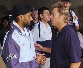 Indian off-spinner Harbhajan Singh having a chat with Australian spinner Shane Warne