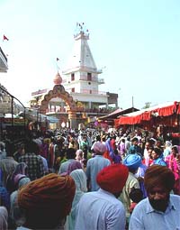 Devotees going to Maiserkhana Temple to get blessings of Durga Bhagwati at Maiserkhana town on the Bathinda-Mansa road on Tuesday