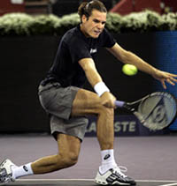 German Tommy Haas returns the ball to Belgian Xavier Malisse