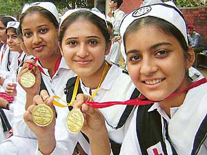Girl students show their medals at the 41 St John’s Ambulance Competitions organised by the District Red Cross Society at Government Girls Multipurpose Senior Secondary School in Patiala on Wednesday.