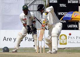 Mathew Sinclair of New Zealand plays a ball off Mohammad Rafiq