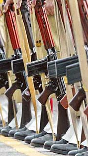 Police officers hold their rifles as they remember their fallen colleagues