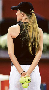 A model holds tennis balls prior the start of play between Spain�s Juan Carlos Ferrero and Peru�s Luis Horna at the Madrid Masters tennis tournament in Madrid