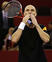Andre Agassi of the US blows kisses after his victory