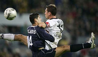 Erik Meijer of Alemannia Aachen tackles Greece Efstathios Tavlaridis of OSC Lille