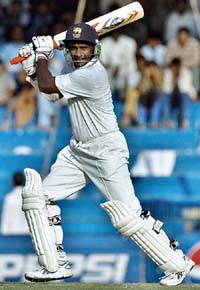 Sanath Jayasuriya hits a boundary off the bowling of Abdul Razzaq during the third day of the first Test