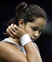 Ana Ivanovic of Serbia and Montenegro wipes sweat from her face
