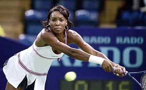 Venus Williams of the US plays a backhand during the quarterfinal match