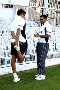Virender Sehwag and Ashish Nehra have a chat at the VCA stadium