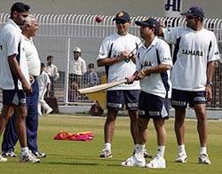 Sachin Tendulkar warms up along with team members in Nagpur on Sunday