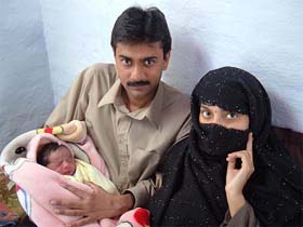 Maqool and Tahira, who were the first couple to get married across the Indo-Pakistan border after resumption of peace talks between the two countries, with their new-born baby