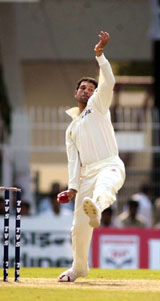 Sachin Tendulkar bowls at the VCA stadium on the first day of the India-Australia Test
