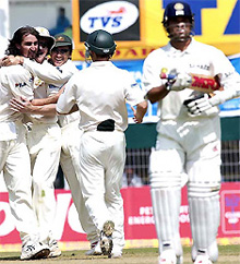 Jason Gillespie is joined by teammates to celebrate the wicket of Sachin Tendulkar in the third Test at Nagpur on Wednesday