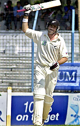 Stephen Fleming celebrates after completing his double century against
