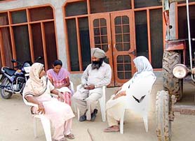 Ramandeep�s father Gurcharan Singh with his family members at his home in Fatehgarh Korotana village near Moga on Thursday.