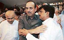Newly elected MPCC Legislative party leader Vilasrao Deshmukh is congratulated by party observer Ghulam Nabi Azad at Vidhan Bhavan in Mumbai on Friday.