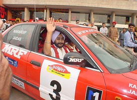 Karandip Singh of Chandigarh is flagged off for the fifth round of the Indian National Rally Championship at Fun Republic, Mani Majra