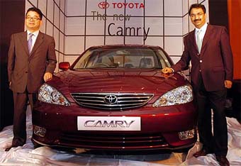 T. Ino, Director Marketing, Toyota Kirloskar Motor (left), and Vikram Kirloskar, Vice-Chairman, with the new version of Toyota Camry car at a function