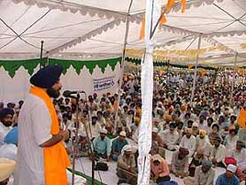 Mr Sukhbir Singh Badal, MP and General Secretary, SAD, addresses a party rally at Badiala village organised in connection with the death anniversary of Sant Fateh Singh, an architect of the Punjabi Suba Movement, on Saturday.