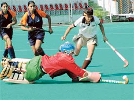 RCF goalkeeper trying to stop the ball during the match against Western Railways in the 21st Indian Oil Surjit Hockey Tournament at Jalandhar