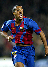 FC Barcelona's Ronaldinho celebrates after scoring a late second goal against AC Milan 