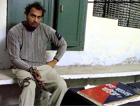 Mr Rajeev Kumar, a resident of Bathinda, in the lock-up of the local thermal police station with his hands tied with iron chains.