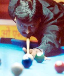 International Alok Kumar of Punjab concentrates during a match in the 4th ONGC National 9-Ball Pool Championship in Ludhiana 