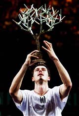 Marat Safin of Russia holds the trophy after winning the final of the Paris Masters Series ATP tennis tournament