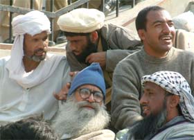 Pakistani prisoners chat before being repatriated to their country through the Wagah joint checkpost