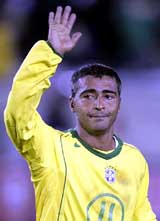 Brazilian soccer star Romario makes a final lap around the field after his grand farewell soccer match in Los Angeles
