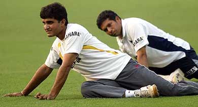Indian captain Sourav Ganguly and Sachin Tendulkar stretch during a practice session in Kolkata