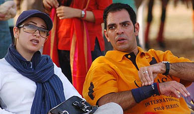 Bollywood actress Karisma Kapoor watches a polo match between India and Argentina with her husband Sanjay Kapoor at Jaipur Polo Ground in New Delhi on Sunday
