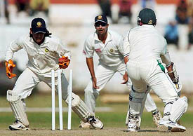 Board President's XI wicketkeeper MS Dhoni stumps South African captain Graeme Smith on the first day of a three-day match in Jaipur 