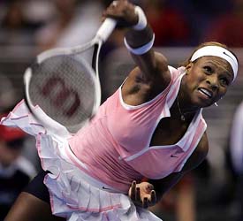 Serena Williams serves during her semifinal match against Amelie Mauresmo of France