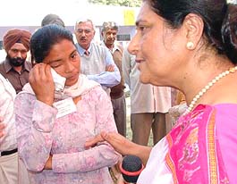 A war widow narrates her tale of woes to an official of the Chetak Army Wives  Welfare Association at Veer Nari meet organised at military station, Bathinda on Tuesday. 