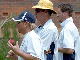 Australian bowlers Shane Warne and Michael Kasprowicz (right) with coach John Buchanan are pictured at practice in the nets at the Gabba in Brisbane