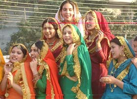 Girls wearing traditional Punjabi costumes take part in procession carried out on the commencement of the second Amritsar heritage festival on Thursday