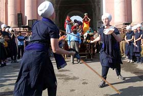 American Sikh girls perform martial arts during the inaugural function of the second Amritsar heritage festival in Amritsar 